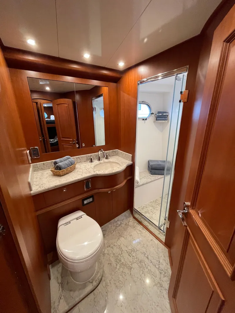 Slide: The Image of Luxurious bathroom in 2024 Northwest 55 yacht with wood accents and modern fixtures. - 31