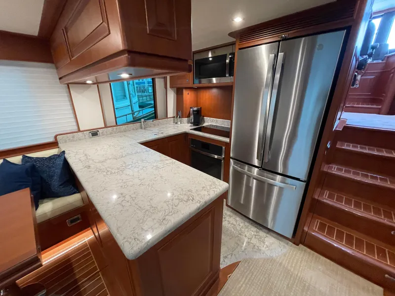 Slide: The Image of Luxurious kitchen in 2024 Northwest 55 yacht with modern appliances and elegant wood finishes. - 33