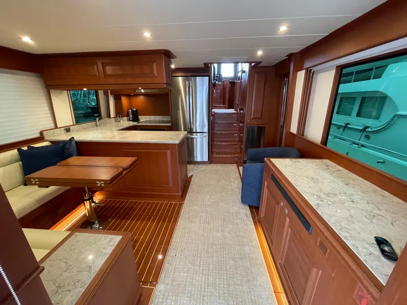 Slide: The Image of Luxurious interior of 2024 Northwest 55 yacht with modern kitchen and dining area. - 40