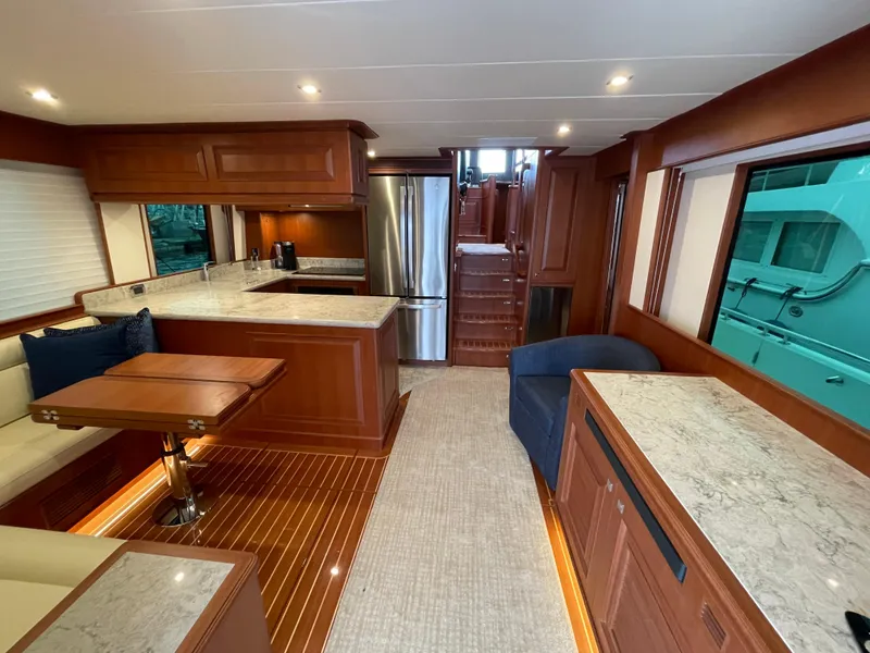 Slide: The Image of Luxurious interior of 2024 Northwest 55 yacht with modern kitchen and elegant wood finishes. - 41