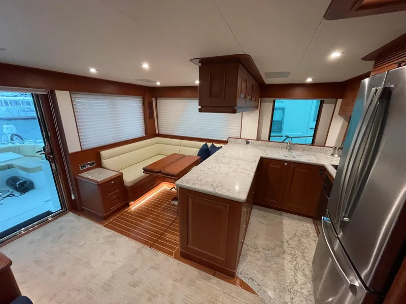 Slide: The Image of Luxurious interior of 2024 Northwest 55 yacht with modern kitchen and cozy seating area. - 44