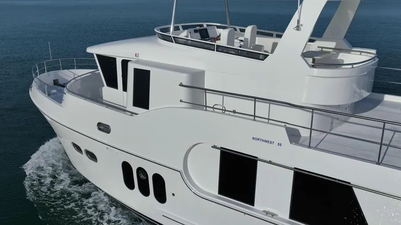 Slide: The Image of 2024 Northwest 55 yacht cruising on open water, showcasing sleek design and modern features. - 7