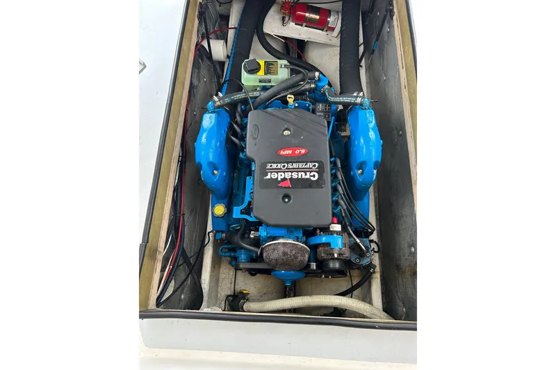 Slide: The Image of Alan Johnson AJ28 engine, 2000 model, featuring Crusader 6.0 MPI, in a boat compartment. - 3