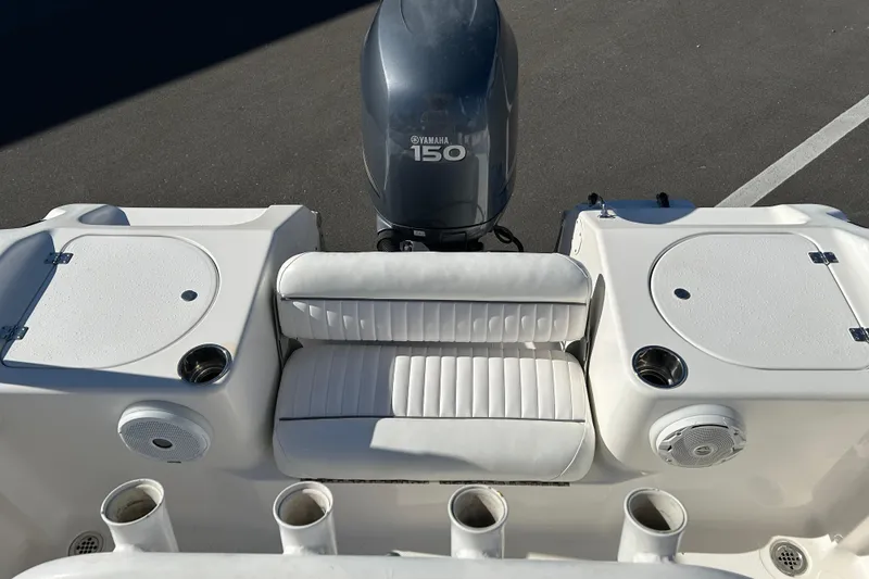 Slide: The Image of 2011 Tidewater 216 CC Adventure boat with Yamaha 150 engine, featuring seating and storage compartments. - 13