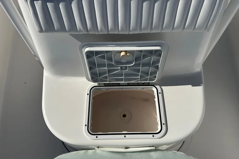 Slide: The Image of Open storage compartment on 2011 Tidewater 216 CC Adventure boat. - 15