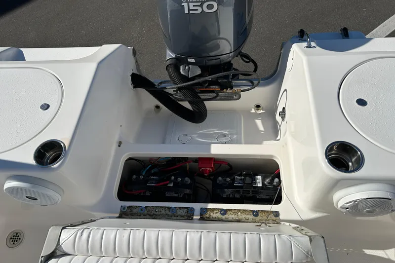 Slide: The Image of 2011 Tidewater 216 CC Adventure boat with Yamaha 150 engine and battery compartment. - 17