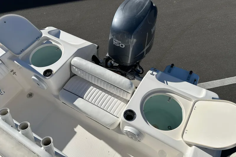 Slide: The Image of 2011 Tidewater 216 CC Adventure boat with Yamaha 150 engine and seating area. - 18