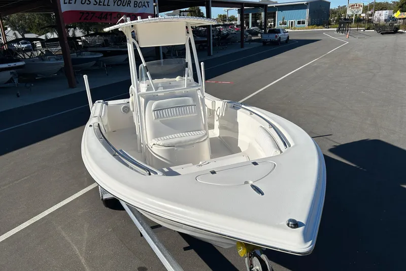 Slide: The Image of 2011 Tidewater 216 CC Adventure boat displayed in a dealership lot. - 6