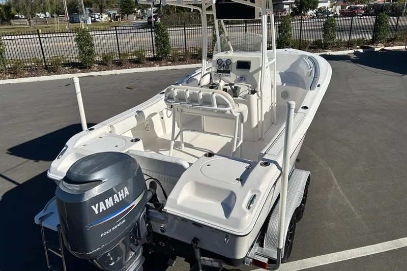 Slide: The Image of 2011 Tidewater 216 CC Adventure boat with Yamaha engine, parked on a trailer. - 7