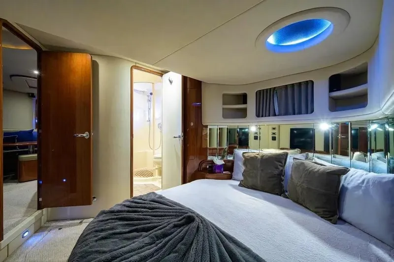 Slide: The Image of Luxurious cabin interior of 2004 Sea Ray 550 Sundancer yacht with elegant bedding. - 10