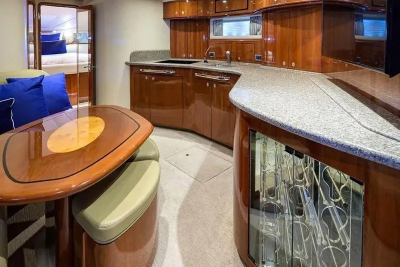 Slide: The Image of Luxurious interior of 2004 Sea Ray 550 Sundancer yacht with elegant wood finishes and modern amenities. - 18