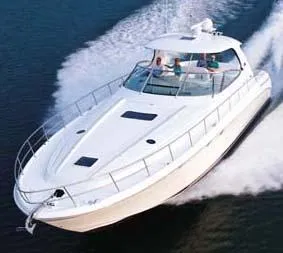 Slide: The Image of 2004 Sea Ray 550 Sundancer helm with Garmin navigation and wood-accented steering wheel. - 4