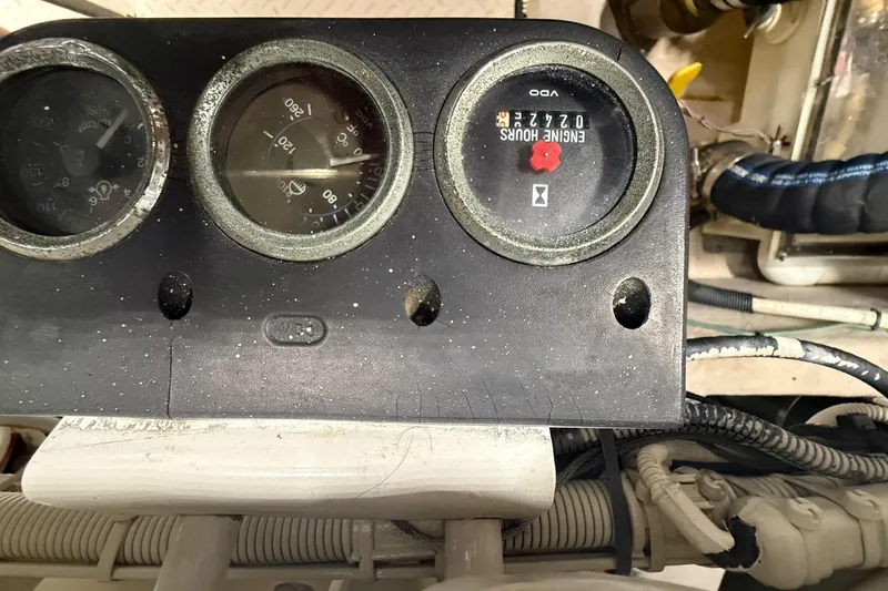 Slide: The Image of Engine compartment of a 2004 Sea Ray 550 Sundancer with visible mechanical components. - 56