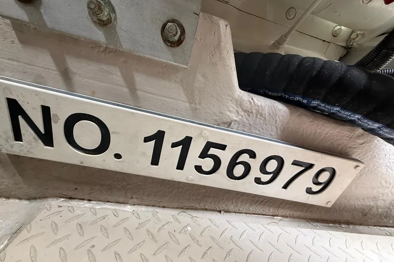 Slide: The Image of Engine room of a 2004 Sea Ray 550 Sundancer with various mechanical components. - 61