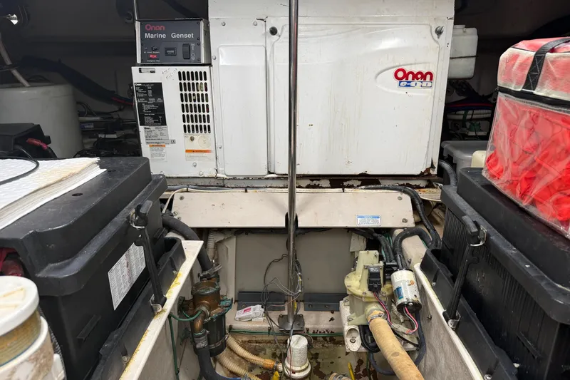 Slide: The Image of Engine room of 2004 Sea Ray 550 Sundancer with Onan marine generator and batteries. - 66