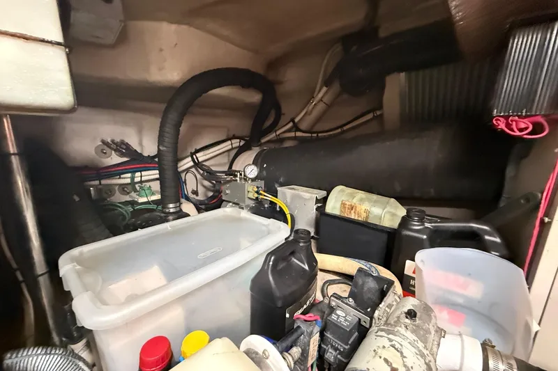 Slide: The Image of 2004 Sea Ray 550 Sundancer yacht docked, showing swim platform and mooring lines. - 76