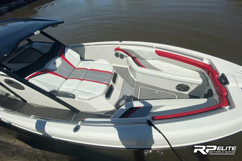 Slide: The Image of 2013 Sunsation 34 CCX boat with red and white seating on the water. - 10