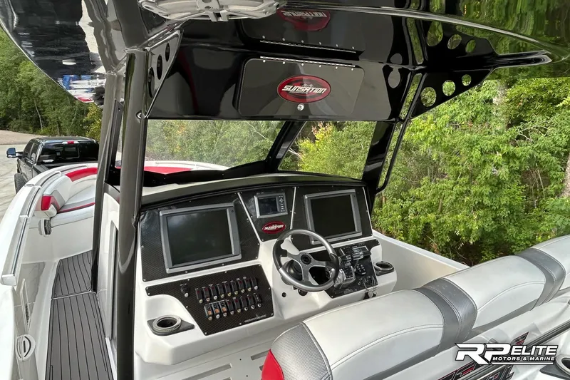 Slide: The Image of 2013 Sunsation 34 CCX boat interior with modern dashboard and steering wheel. - 13