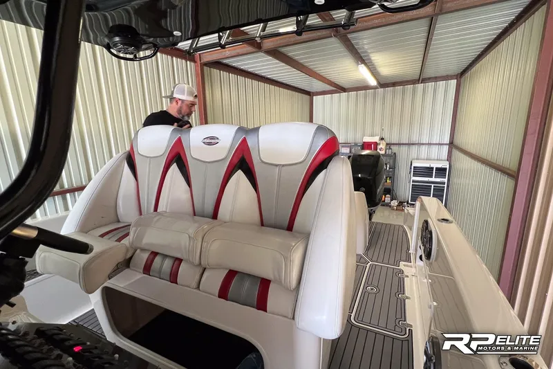 Slide: The Image of 2013 Sunsation 34 CCX boat interior with stylish seating in a storage facility. - 16
