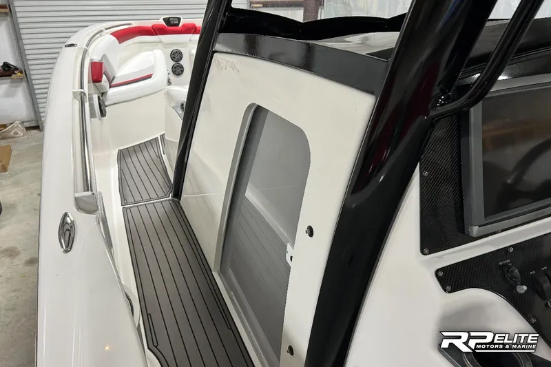 Slide: The Image of 2013 Sunsation 34 CCX boat interior with sleek design and modern dashboard. - 19