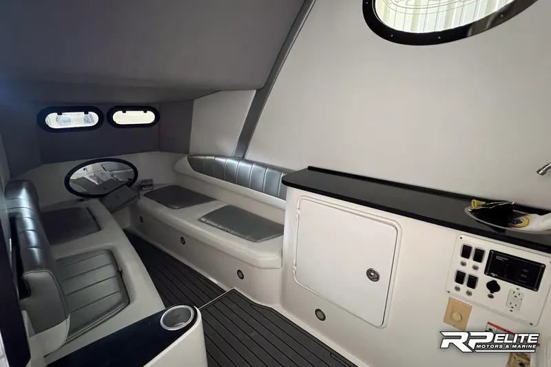 Slide: The Image of 2013 Sunsation 34 CCX cabin interior with seating and control panel. - 21