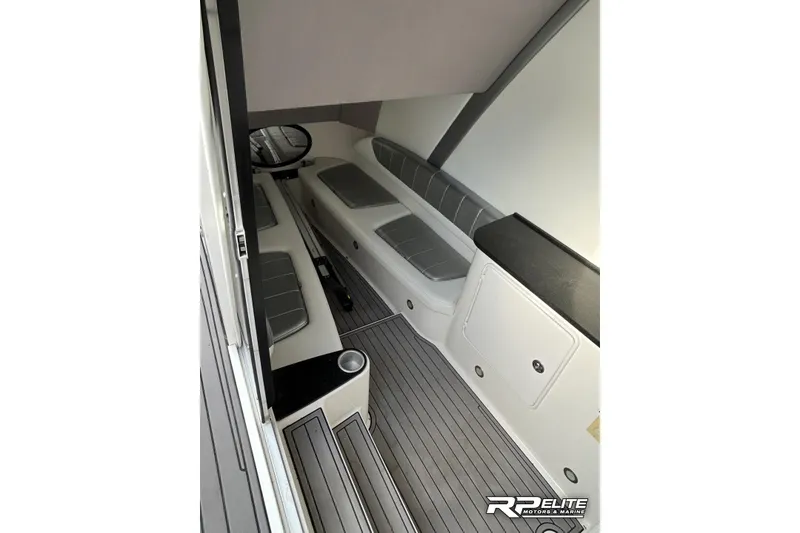 Slide: The Image of 2013 Sunsation 34 CCX boat interior with gray seating and sleek design. - 22
