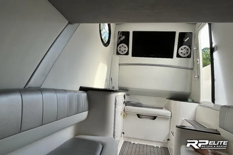 Slide: The Image of Interior of 2013 Sunsation 34 CCX boat with seating, TV, and speakers. - 23