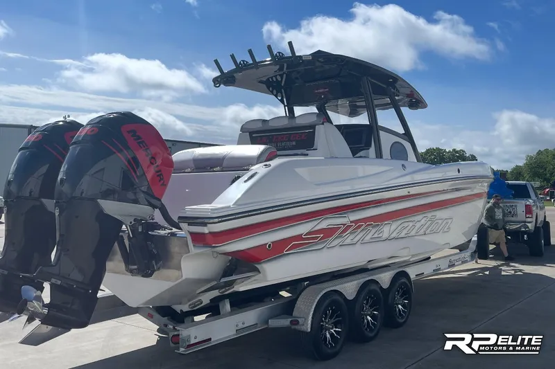 Slide: The Image of 2013 Sunsation 34 CCX boat on trailer with twin Mercury engines, parked outdoors. - 24