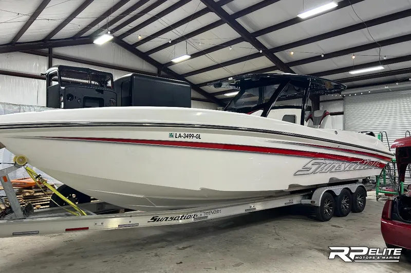Slide: The Image of 2013 Sunsation 34 CCX boat on trailer in indoor storage facility. - 29
