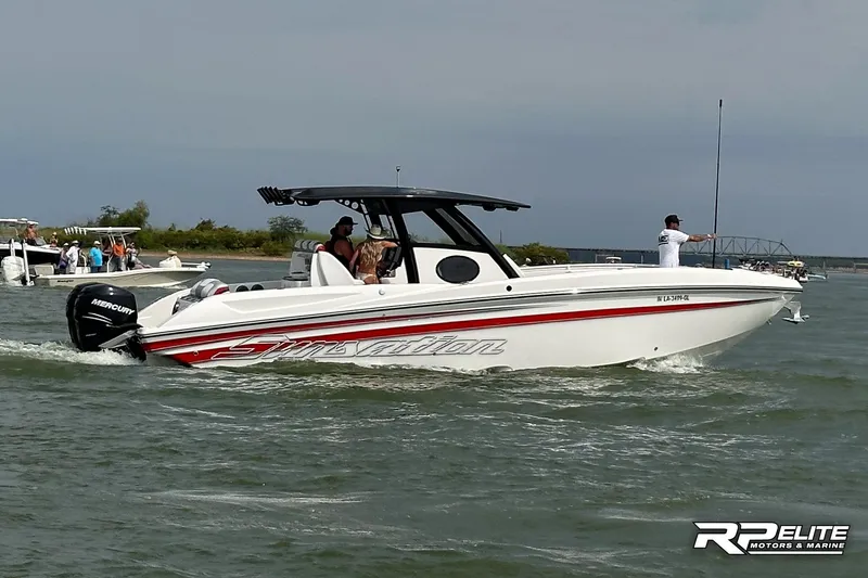Slide: The Image of 2013 Sunsation 34 CCX boat cruising on water with passengers, featuring Mercury outboard engines. - 30