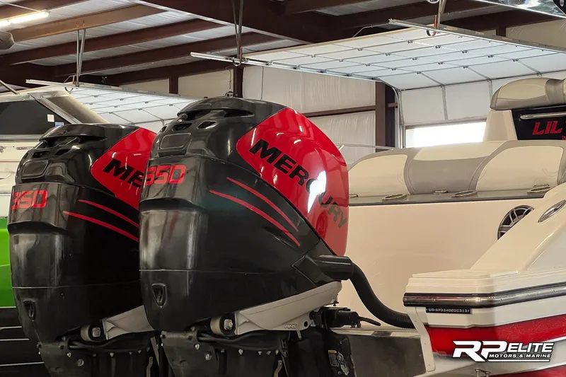 Slide: The Image of 2013 Sunsation 34 CCX with twin Mercury 350 engines in a garage setting. - 4