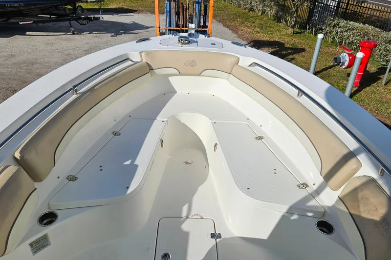 Slide: The Image of 2018 NauticStar 25 XS boat interior with spacious seating and storage compartments. - 5