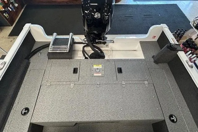 Slide: The Image of 2026 Lund 1650 Rebel XL SS boat interior with steering wheel and dashboard controls. - 11