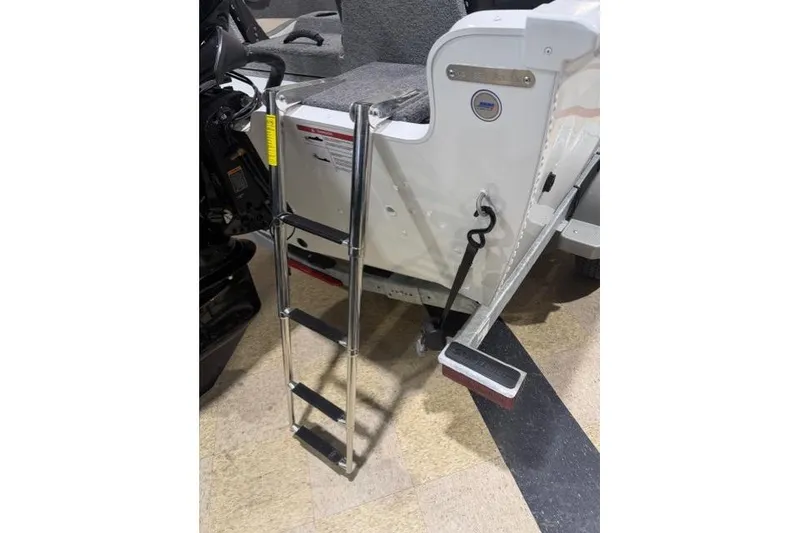 Slide: The Image of 2026 Lund 1650 Rebel XL SS boat with attached boarding ladder. - 20