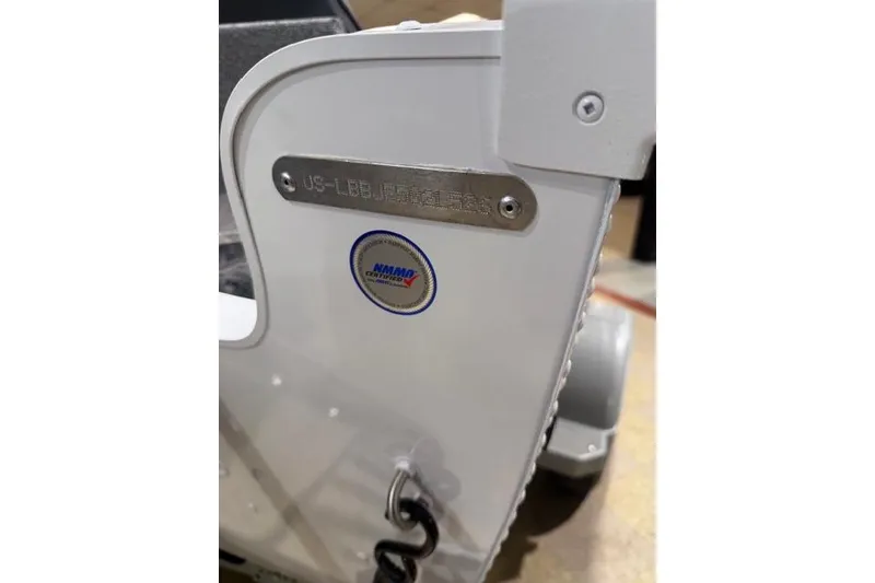 Slide: The Image of 2026 Lund 1650 Rebel XL SS boat detail with identification plate and NMMA certification sticker. - 21