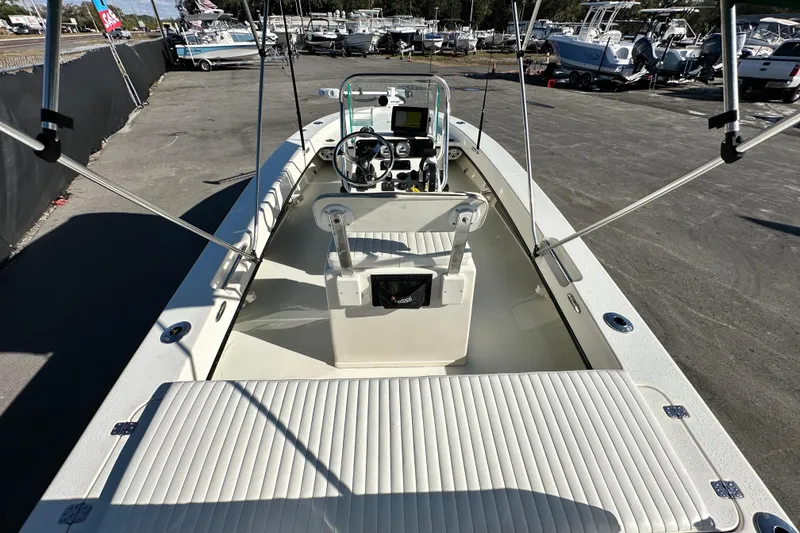Slide: The Image of 2014 Young Boats 20 Bay Boat interior with steering console and seating. - 13