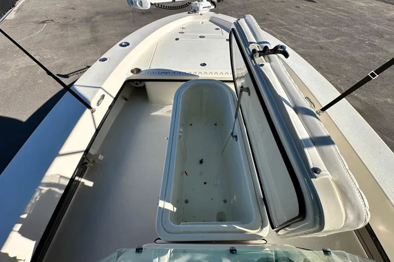 Slide: The Image of 2014 Young Boats 20 Bay Boat with open storage compartment on deck. - 28