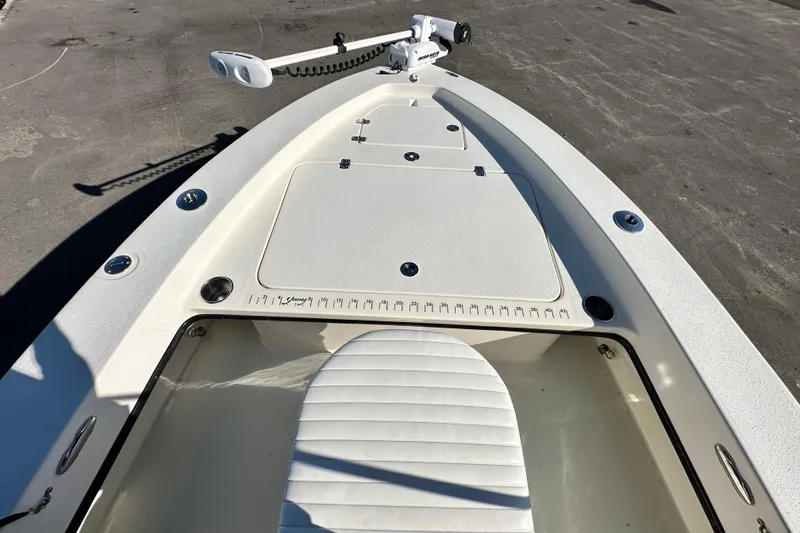 Slide: The Image of 2014 Young Boats 20 Bay Boat deck with trolling motor and storage compartments. - 29