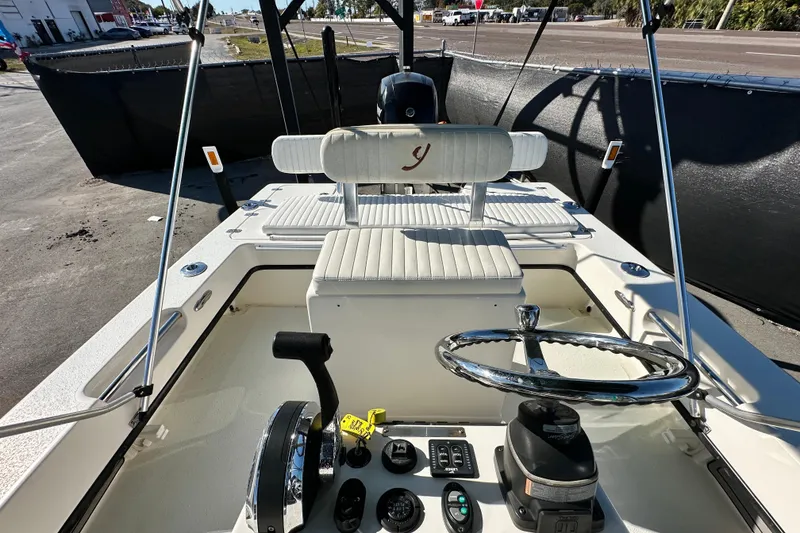 Slide: The Image of 2014 Young Boats 20 Bay Boat interior with steering wheel and seating. - 43