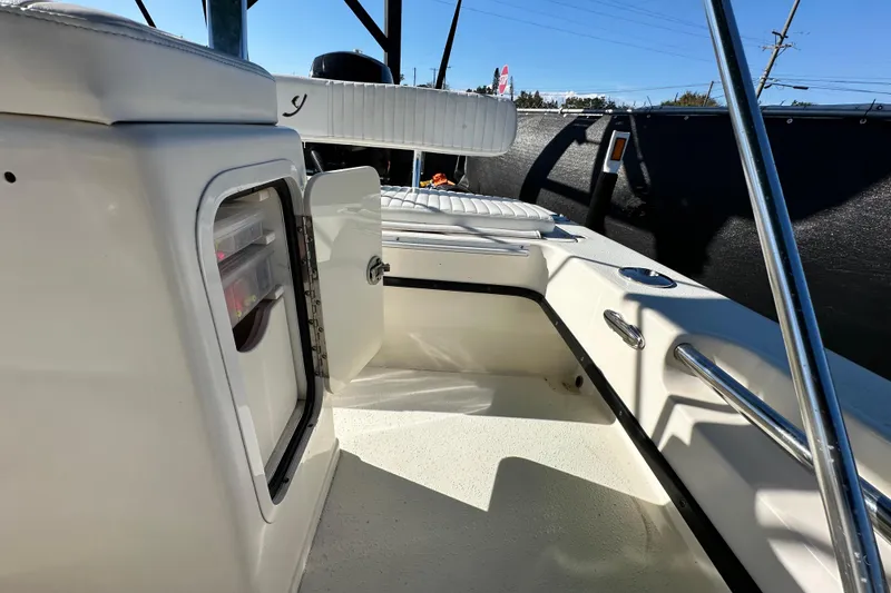 Slide: The Image of 2014 Young Boats 20 Bay Boat interior with open storage compartment. - 45
