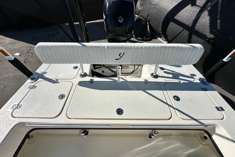 Slide: The Image of 2014 Young Boats 20 Bay Boat with storage compartments and seating, viewed from above. - 47