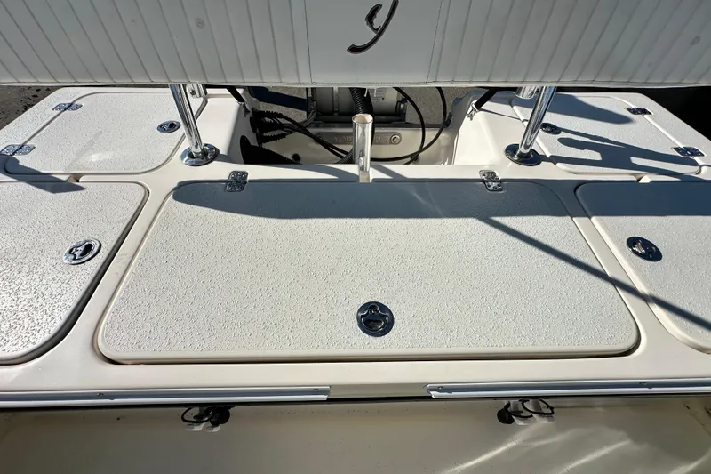 Slide: The Image of 2014 Young Boats 20 Bay Boat deck with storage compartments and stainless steel fittings. - 50