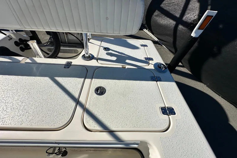 Slide: The Image of 2014 Young Boats 20 Bay Boat interior with storage compartments and seating. - 52