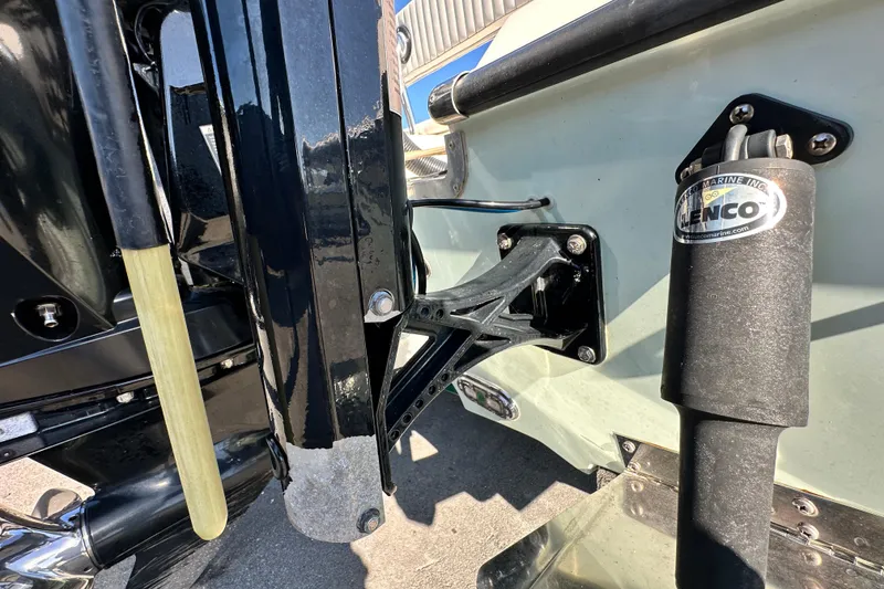 Slide: The Image of Trailer wheels of a 2014 Young Boats 20 bay boat on pavement. - 64