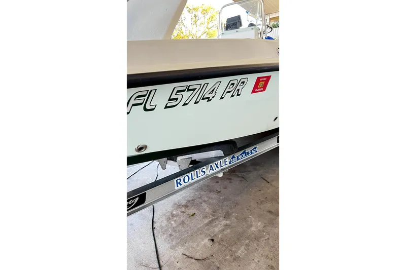 Slide: The Image of 2014 Young Boats 20 Bay Boat on trailer under sunny sky. - 7