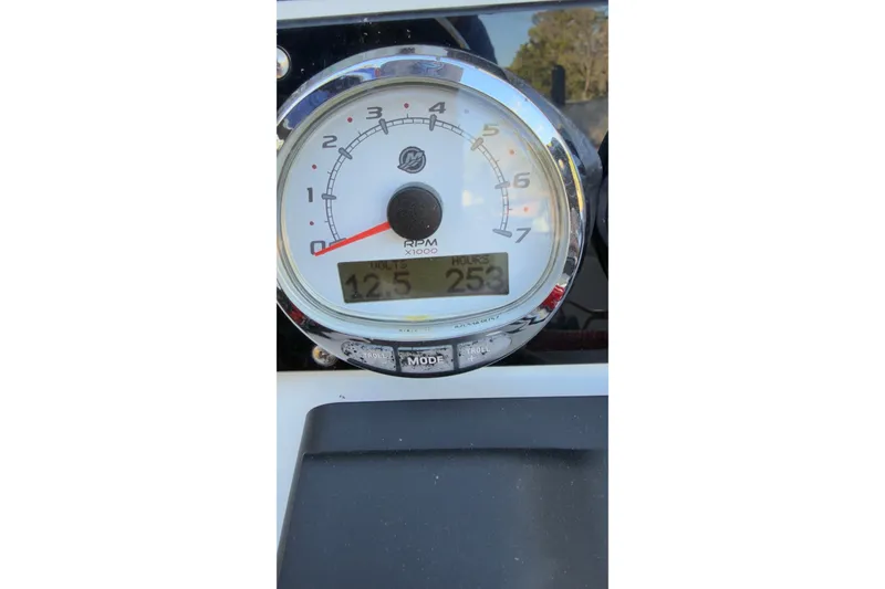 Slide: The Image of 2014 Young Boats 20 Bay Boat on trailer, featuring Minn Kota motor, under clear blue sky. - 8