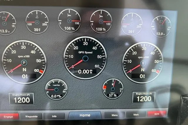 Slide: The Image of Dashboard of a 2019 Regal 33 OBX boat showing engine metrics and GPS speed. - 12