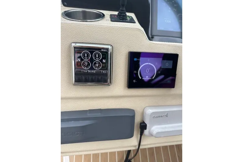 Slide: The Image of Control panel of a 2019 Regal 33 OBX boat with navigation displays. - 17