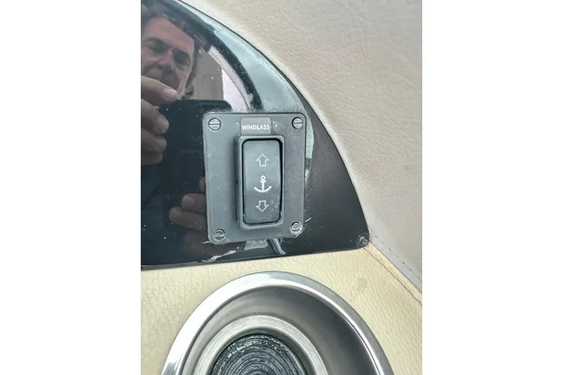 Slide: The Image of 2019 Regal 33 OBX boat windlass control switch with anchor symbols. - 19