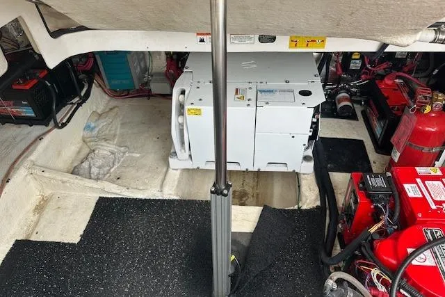 Slide: The Image of Engine compartment of 2019 Regal 33 OBX with generator and fire extinguisher. - 24